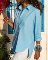 Långärmad oversized skjorta med oregelbunden slits