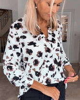 Blus med tryck och v-ringning