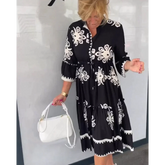 Blommig klänning med 3/4 ärm