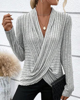 V-ringad crossover stickad topp