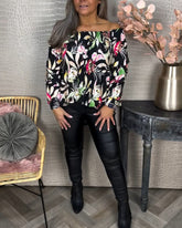 Blus med tryck och en axel