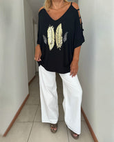 Off-shoulder topp med fjäderpaljetter