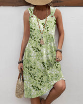 Avslappnad ärmlös klänning med bladtryck