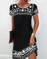 Enkel tryckt klänning med rund hals