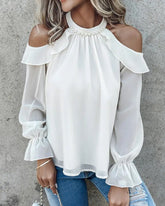 Blus med kalla axlar och pärldekor