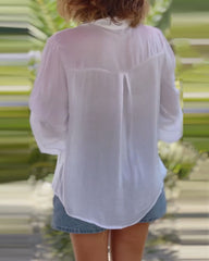 Enfärgad blus med långa ärmar