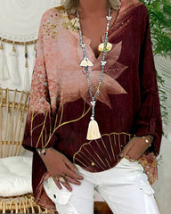 Topp med V-ringad långärmad med tryckt