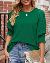 Enfärgad topp med rund hals och halvärm