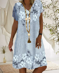 V-ringad avslappnad klänning i blommönster med kort ärm