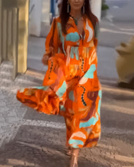 Avslappnad tryckt klänning med lång ärmar