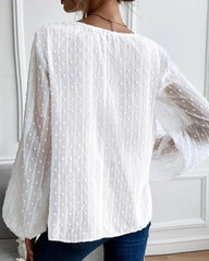 Enfärgad blus med V-ringad