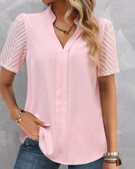 V-ringad enfärgad kortärmad blus