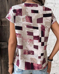 T-shirt med geometriskt tryck och rund hals