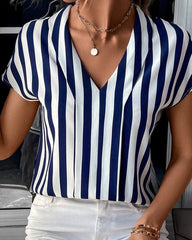 V-ringad blus med randigt tryck