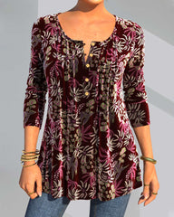 Blommönster topp med delad hals