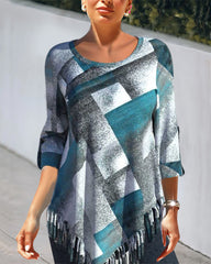 Topp med tofs och rutigt tryck