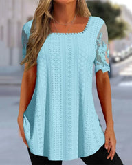 Ihålig broderiblus med kort ärm