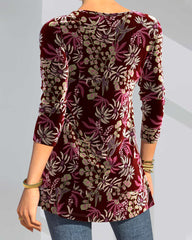 Blommönster topp med delad hals