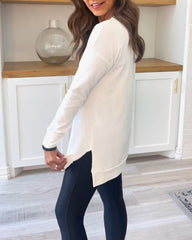 Enfärgad topp med långa ärmar