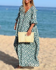 V-ringad klänning med fyrkantigt tryck