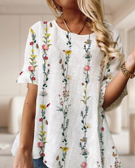 Topp med rund hals i blommönster