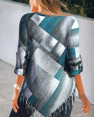 Topp med tofs och rutigt tryck