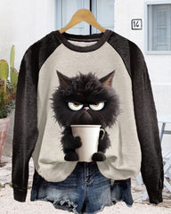 Lös sweatshirt med kattmotiv och färgblock