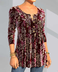 Blommönster topp med delad hals