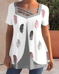 Blus med fjädertryck