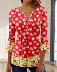 V-ringad blus med knapp i tryck och 3/4-ärm