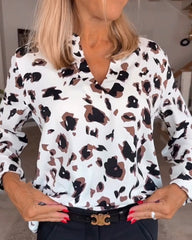 Blus med tryck och v-ringning