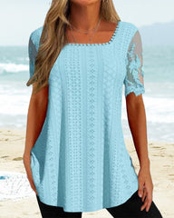 Ihålig broderiblus med kort ärm