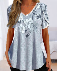 Elegant kort ärmad blus i blommigt tryck