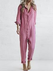 Långärmad jumpsuit med knäppning och avslappnad reversficka