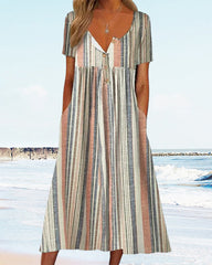 Klänning med randigt färgblock och fickor