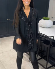 Blus med volanger och elegant stil