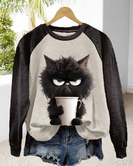 Lös sweatshirt med kattmotiv och färgblock