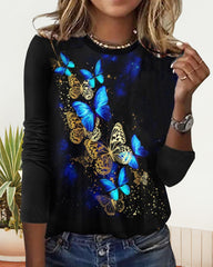 Topp med rund hals och fjärilstryck