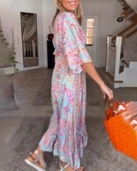 V-ringad halvärmad tryckt klänning