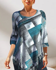 Topp med tofs och rutigt tryck