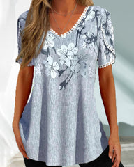 Elegant kort ärmad blus i blommigt tryck