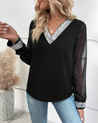 Blus med paljetter och V-ringning