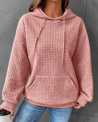 Enfärgad huvtröja med fickor