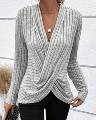 V-ringad crossover stickad topp