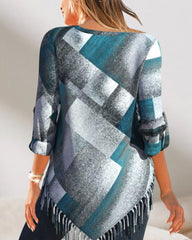 Topp med tofs och rutigt tryck