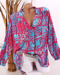 V-ringad avslappnad blus i tryck med lång ärm