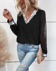 Blus med paljetter och V-ringning