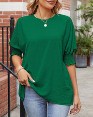 Enfärgad topp med rund hals och halvärm