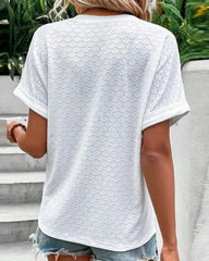 Avslappnad v-ringad enfärgad blus med knappar