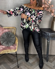 Blus med tryck och en axel